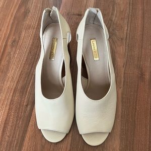 Never worn zip up heels.